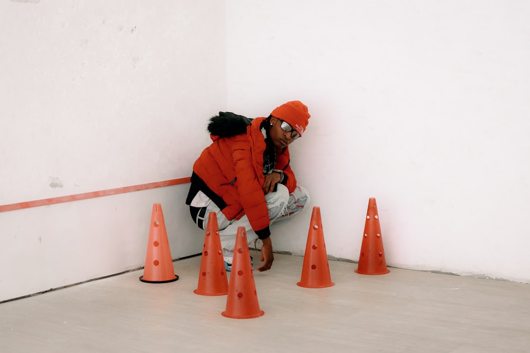 stop-tripping-over-your-own-feet-with-this-agility-guide-image athlete cutting around cones during agility training program
