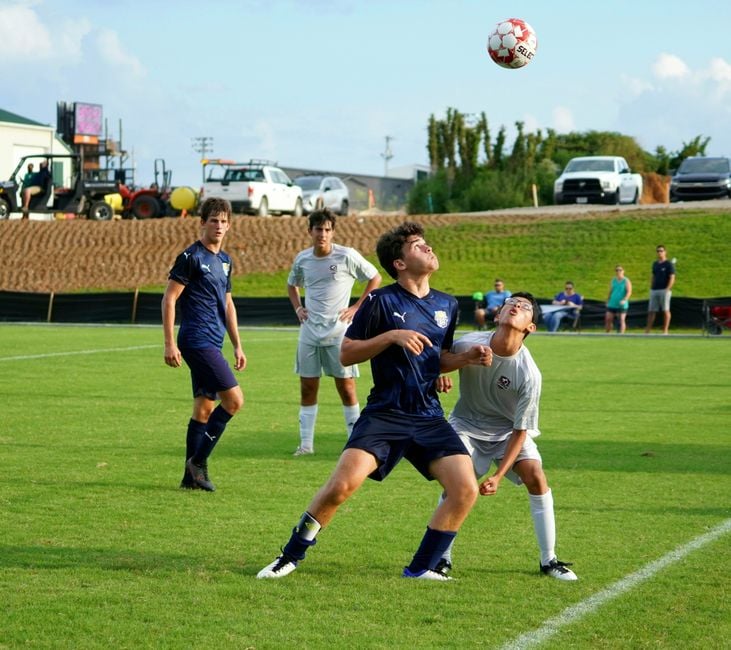 top-youth-athletic-camps-in-knoxville-to-keep-your-kids-active-image Youth athletic camps Knoxville kids playing sports outdoors in summer